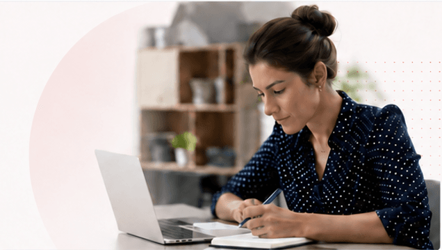 A team member reviewing research on a laptop